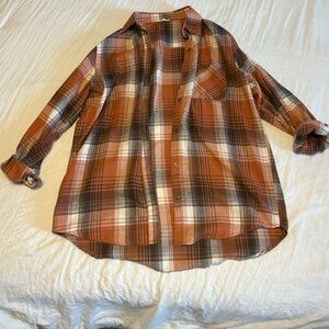 Orange/Brown plaid oversized button up shirt. Size small.